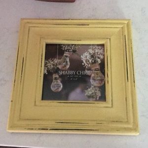This is a small Shabby Chic 7x7” square frame in yellow. It has glass in front.